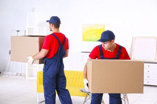 Removal team loading furniture for a same day move in Watford