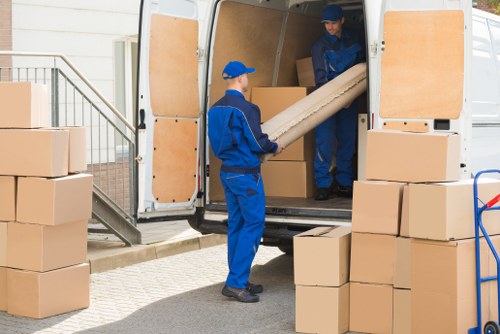 Removal van and moving team helping with a house move in Watford
