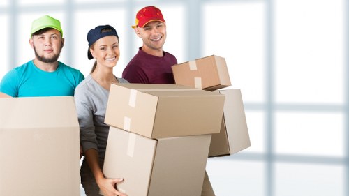 Packed student boxes and furniture ready for collection in Watford