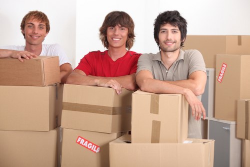 Professional movers loading a van for a Watford relocation