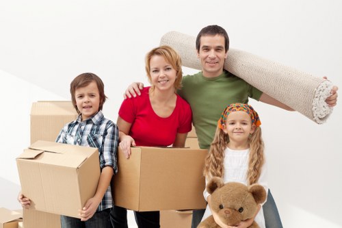 Local movers handling office furniture and boxes during a business move
