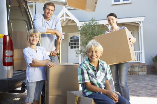 Packed moving boxes and furniture loaded into a removal truck