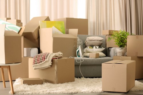 Careful unloading of household items at a Watford property