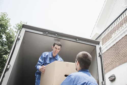 Packed boxes and furniture prepared for a house move in Watford